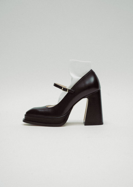 Black high-heeled shoe on a white background