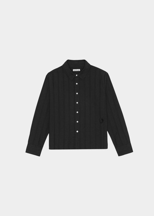 Black button-up shirt on a light gray background